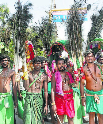 devotees carrying 'Mayil Kavadi' to Lord Subramaniaswamy